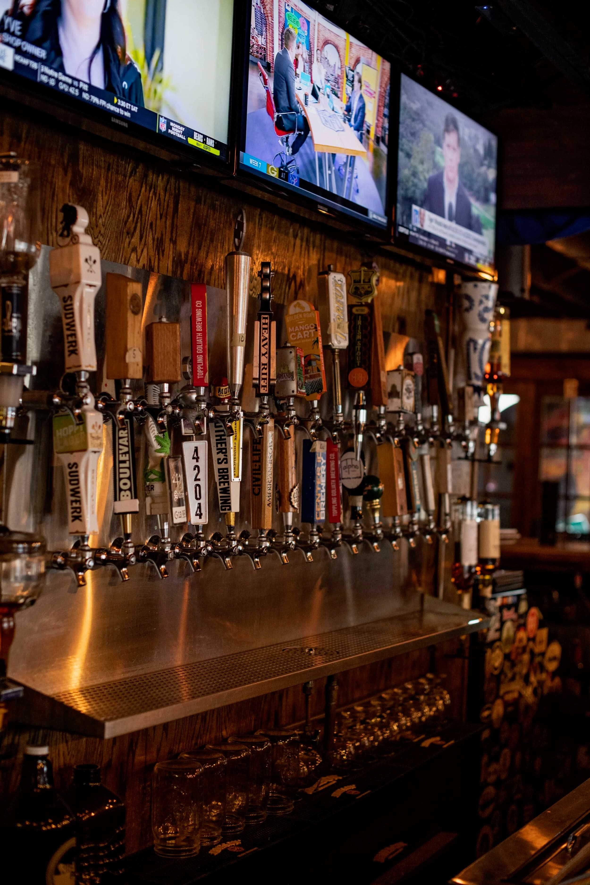 Rows of draft beer taps behind the bar at SOHA